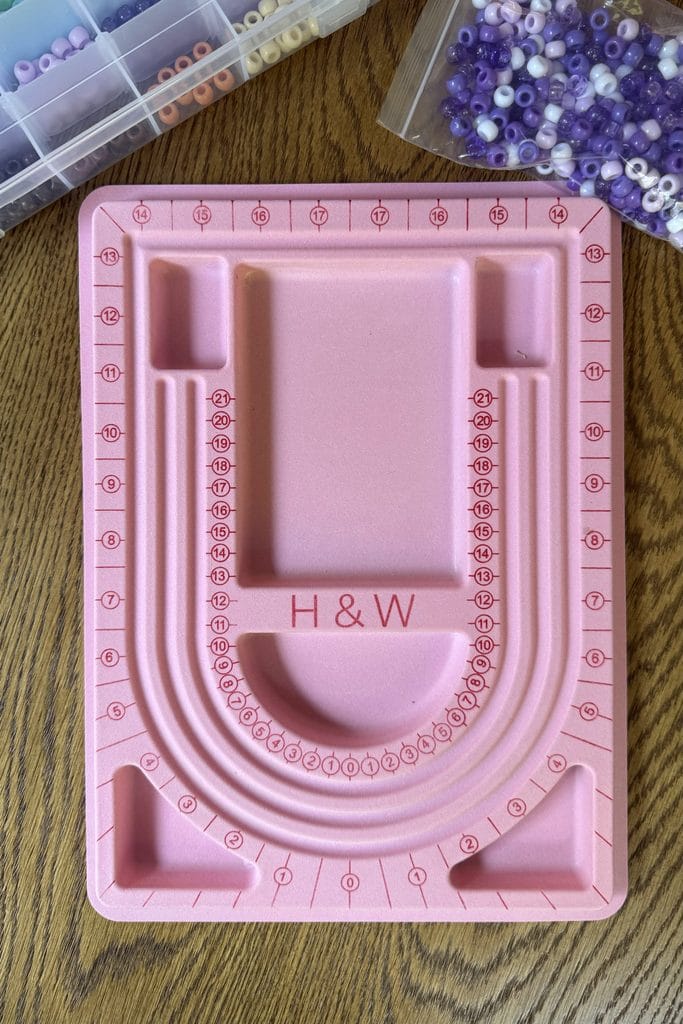 Pink flocked bead board for bracelet making for kids, keeping beads in place while designing